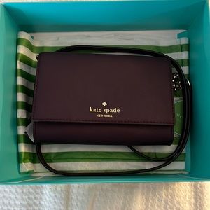 Kate Spade burgundy crossbody purse with gold accents. Brand new.